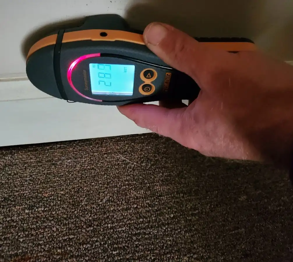 Moisture detection at baseboard during Sewage Cleanup & Sanitation in Portage Lakes